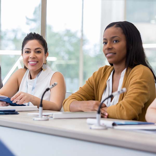 Several Master of Public Administration students in a public meeting