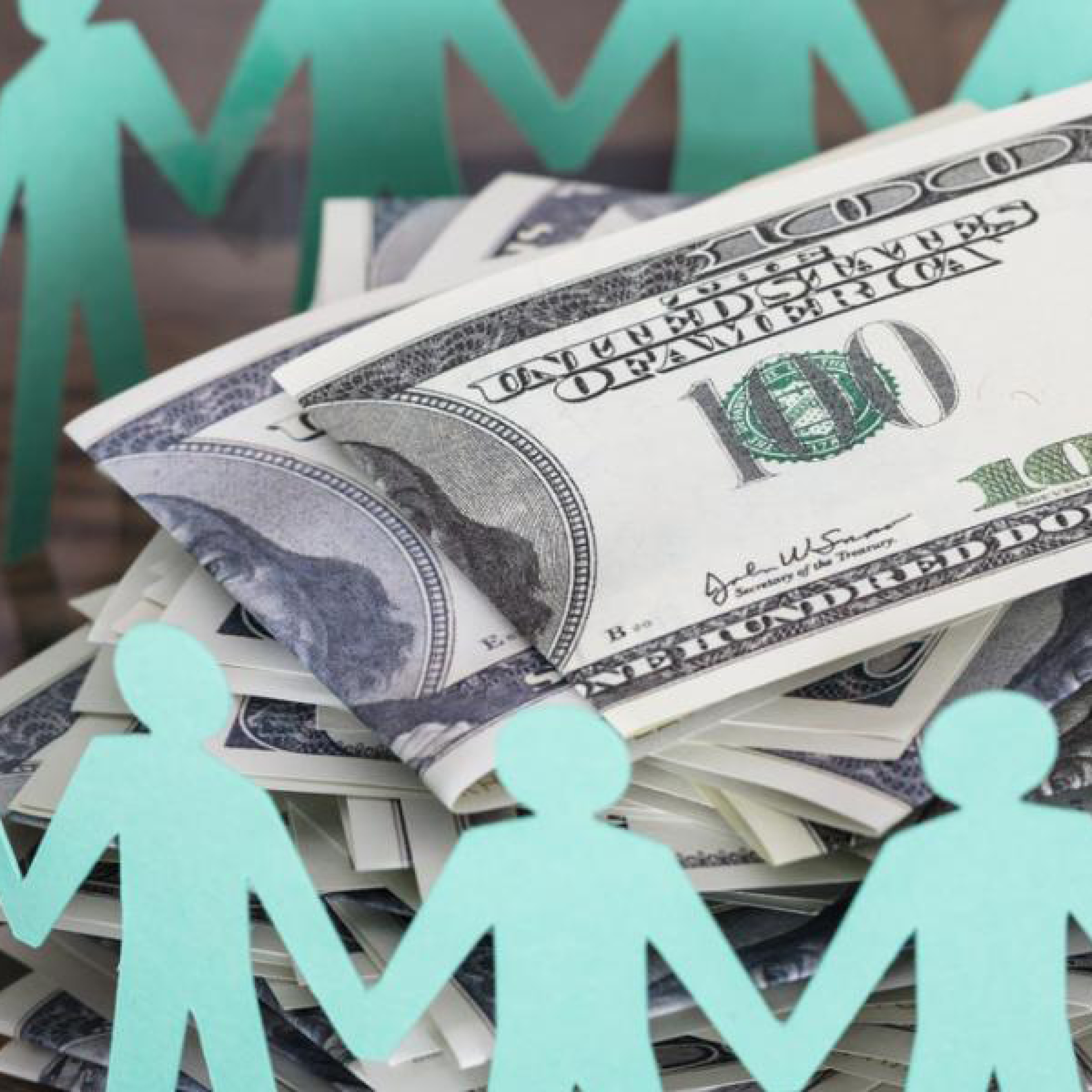 image of cutout people surrounded by money