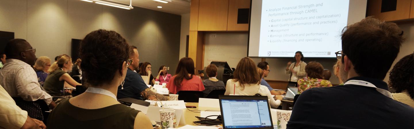 Students in a class learning about community finance