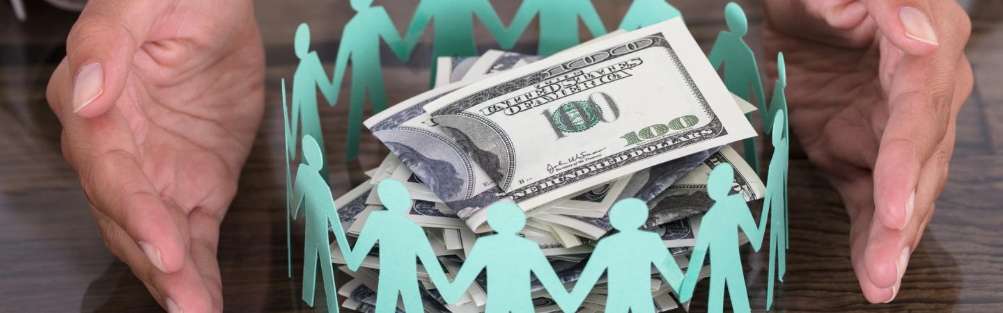hands around circle of cutout people with money bills