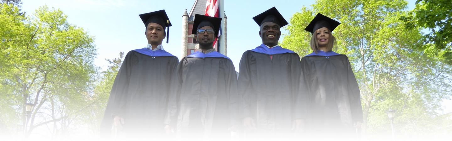 A photo of four graduates of the Carsey School of Public Policy