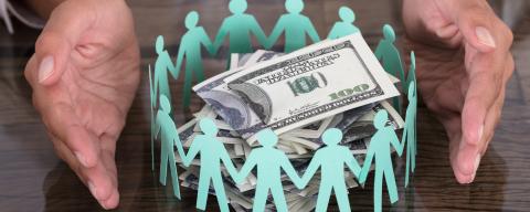 hands around circle of cutout people with money bills