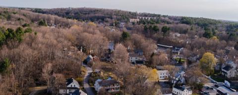 aerial view of newmarket new hampshire showing houses and mountains