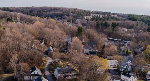 aerial view of newmarket new hampshire showing houses and mountains