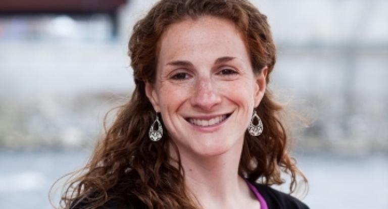 A photo of Sarah Dorner in front of the ocean
