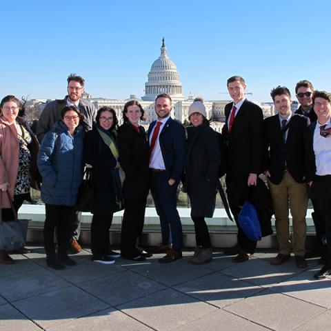 Photo showing Carsey School students and staff standing in front of the U.S. Capitol building. 