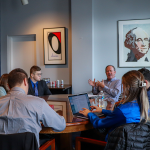 mpp students sitting in a think tank meeting in washington dc as part of the washington dc colloquium