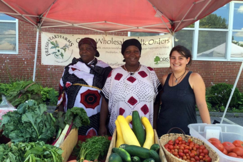 charlene higgins with members of the new american farmers cooperative.