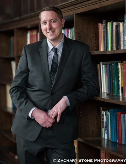 James Vayo standing in a study