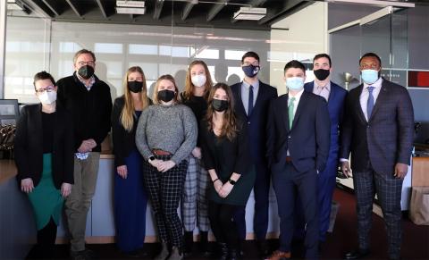 A photo of Tricia Foster with members of her Master in Public Policy cohort standing with David Dixon