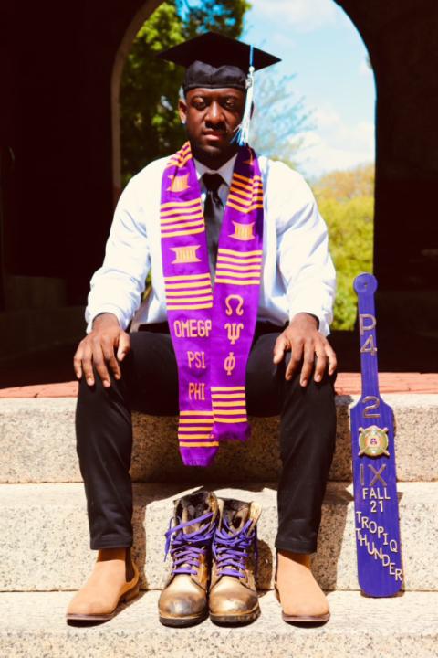 MPA alumni Derek Thompson '23G with grad cap and fraternity colors