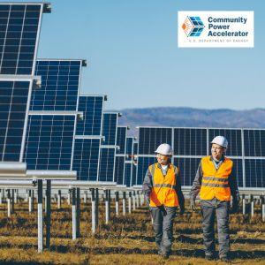 solar panels in a field with workers