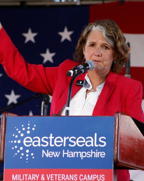 MCD alum Maureen Beauregard speaking at a podium at an Easterseals event