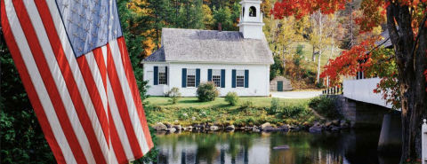 American flag hanging in front of a lake church fall back drop