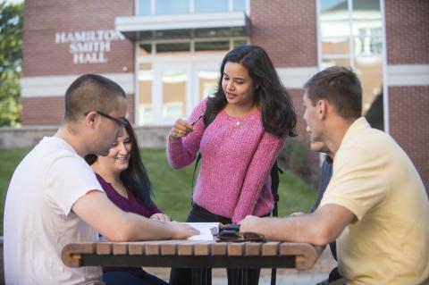 Image of students working together in front of Hamilton Smith Hall
