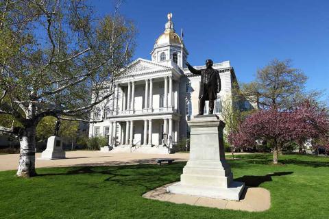 Photo of statue in front of New Hampshire State House.