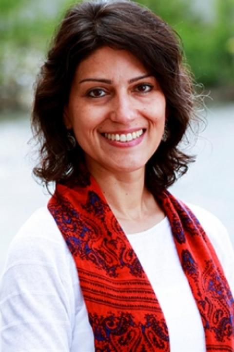 image of Melinda Negron-Gonzales wearing a red scarf