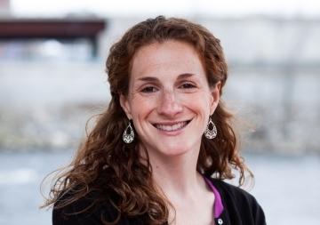 A photo of Sarah Dorner in front of the ocean