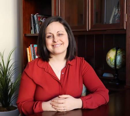 Photo of Sarah Wrightsman in an office area.