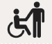 Icon of a wheelchair getting assistance from a person standing