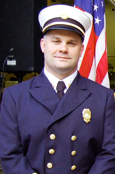 A photograph of MPA graduate and fire chief Robert Buxton