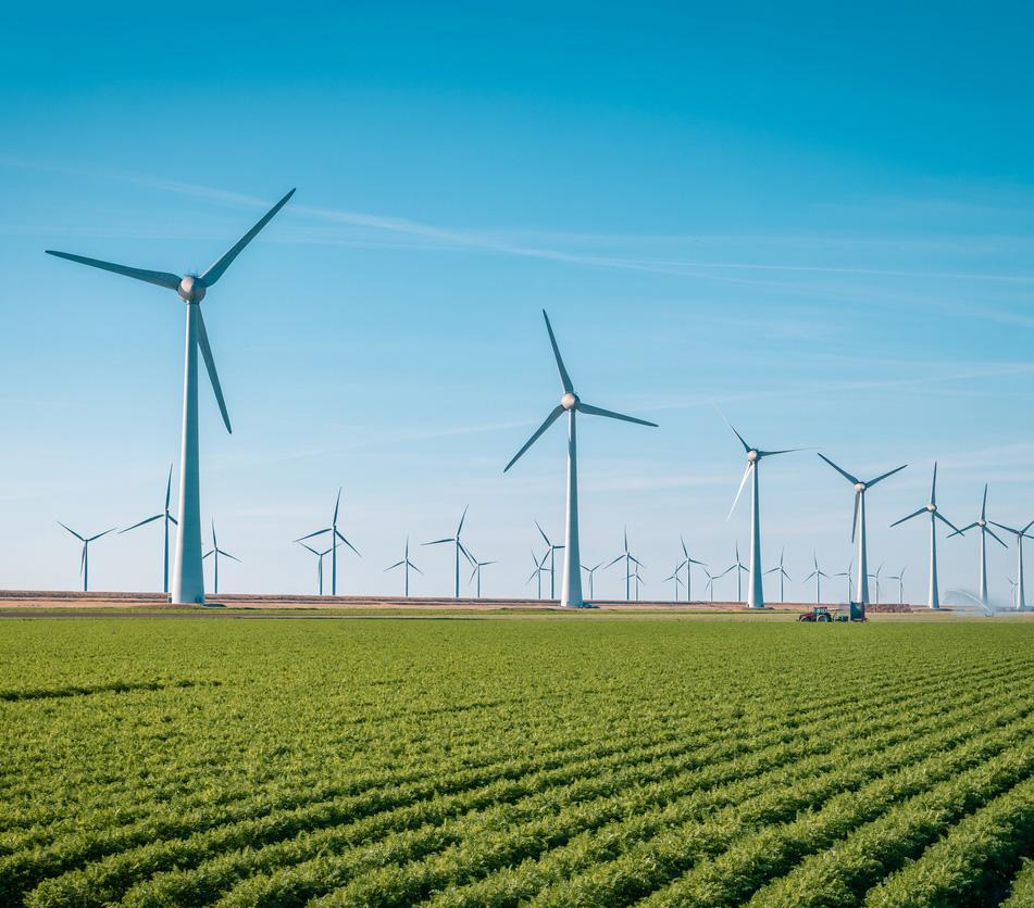 A photo of windmills producing green energy